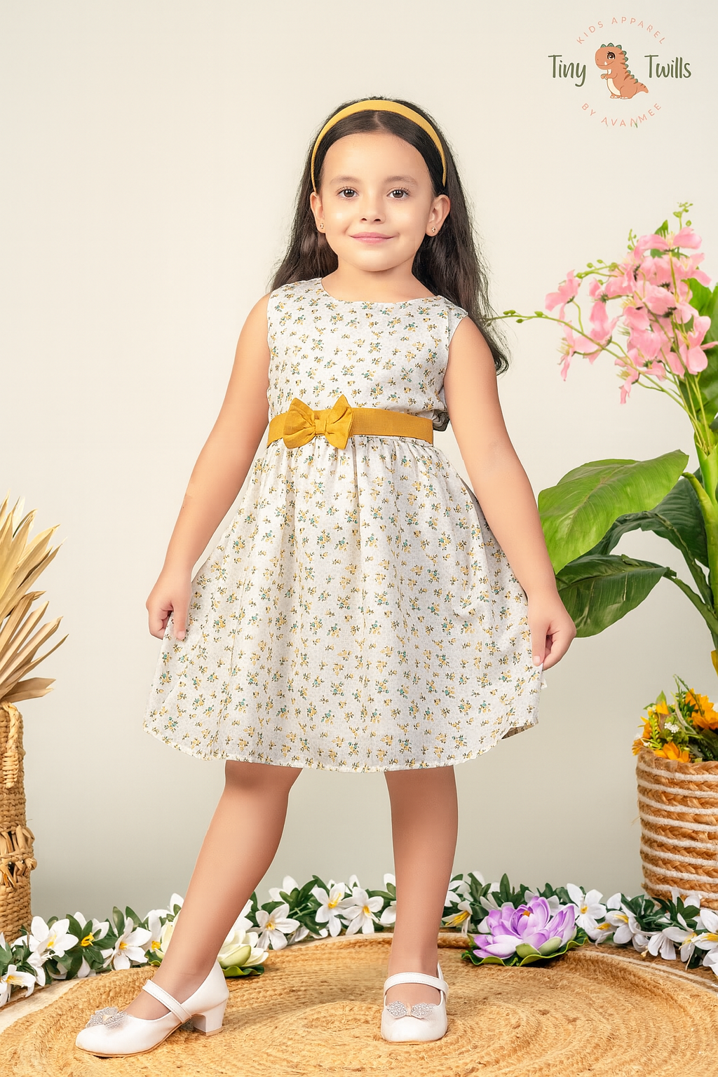TINY TWILLS Girls Floral Cotton Frock – Sleeveless White Dress with Yellow Bow Belt | Elegant Summer Party Wear