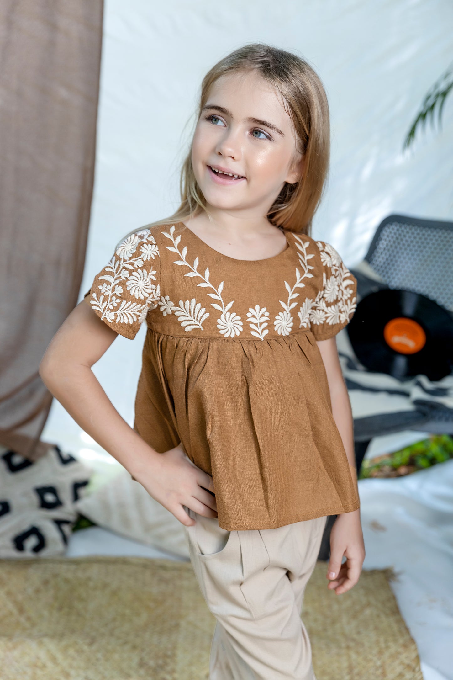 BROWN EMBROIDERED TOP  PAIRED WITH BEIGE PANTS