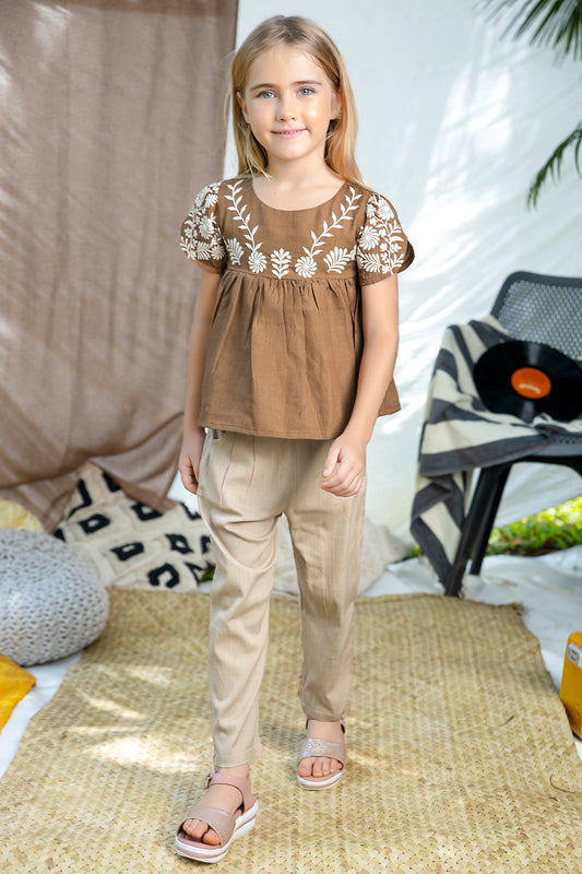 BROWN EMBROIDERED TOP  PAIRED WITH BEIGE PANTS