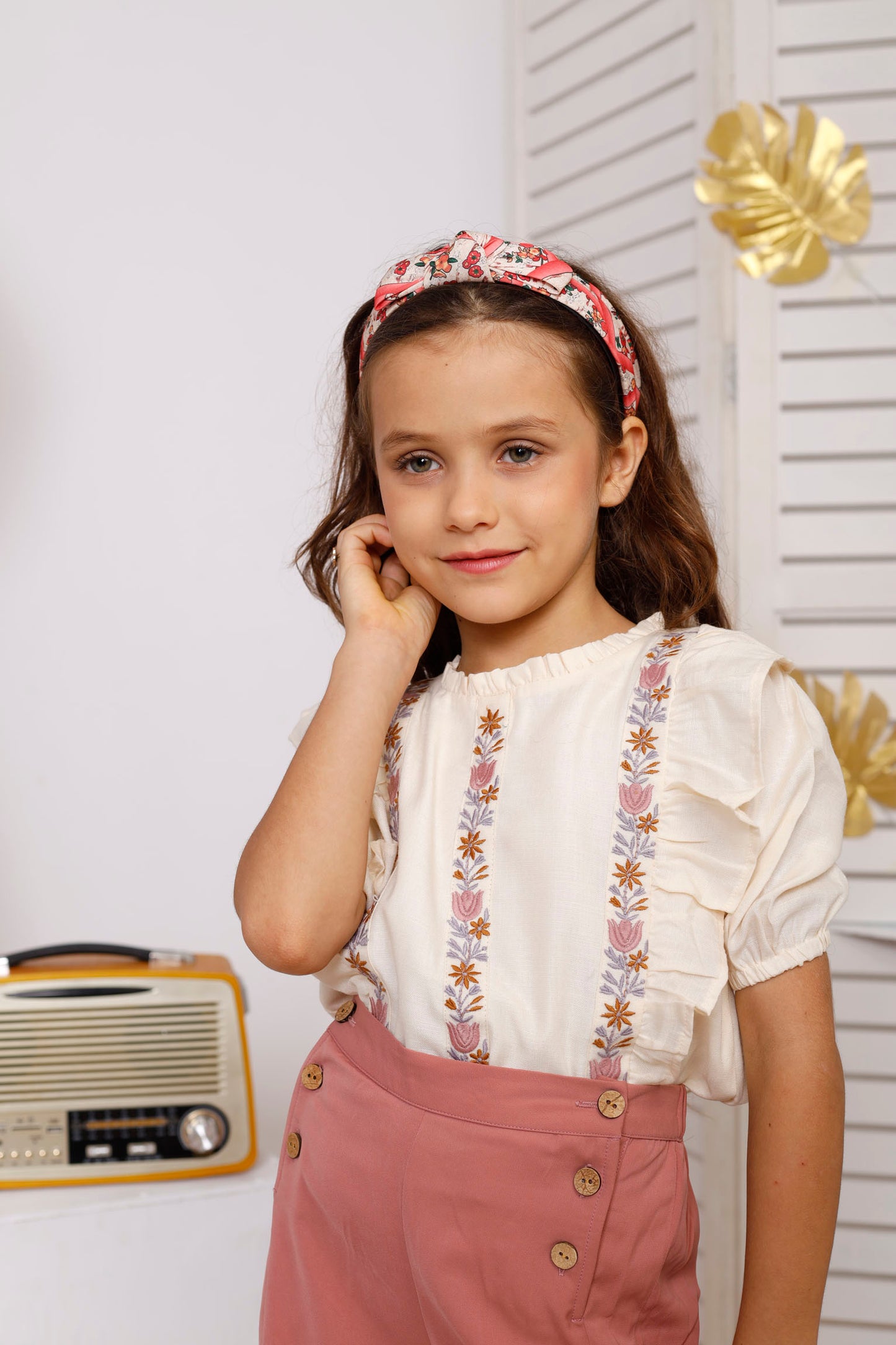 WHITE EMBROIDERED TOP PAIRED WITH PINK FLARED  PANTS