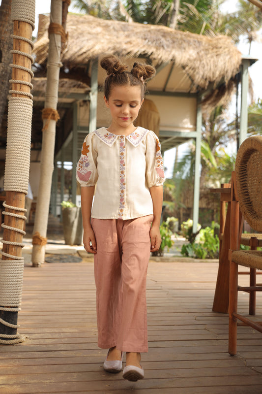 WHITE EMBROIDERED SHIRT PAIRED WITH PINK PANTS