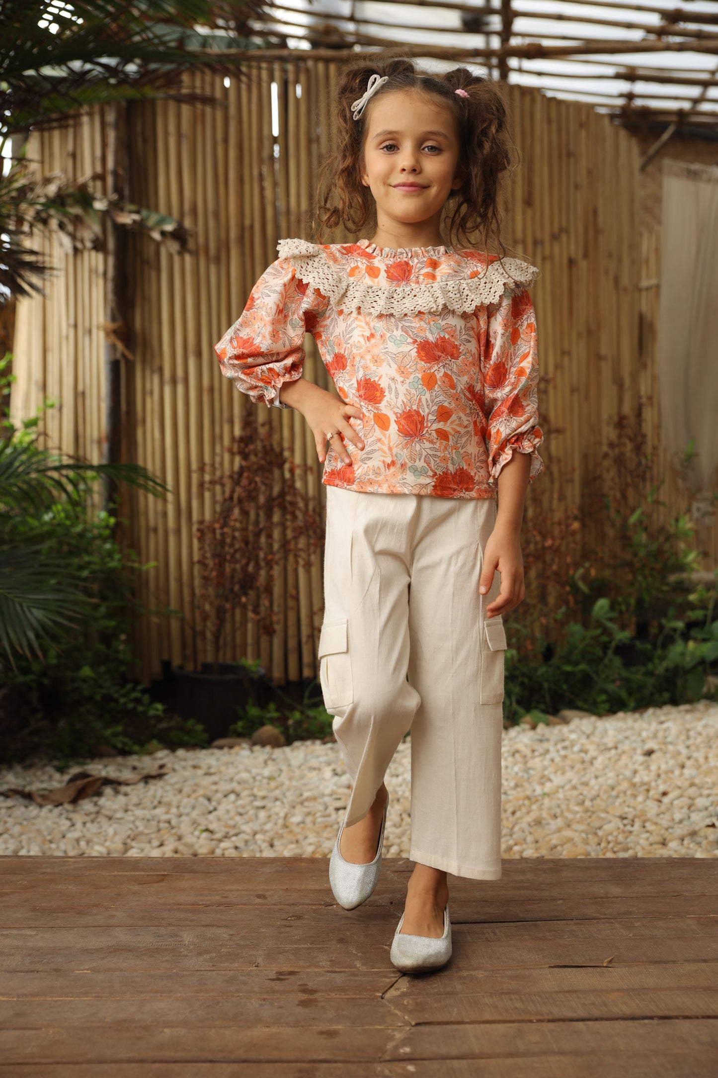 FLOWER PRINTED TOP WITH  CROCHET FRILL PAIRED WITH  OFF - WHITE CARGO PANTS